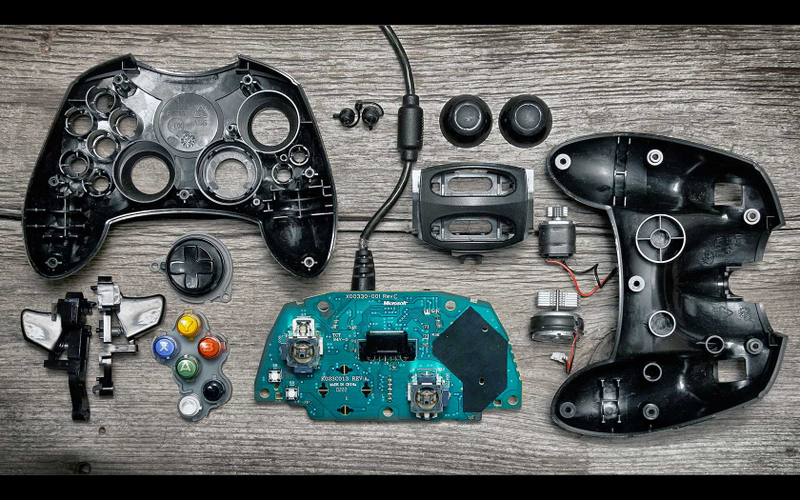 Illustration for article titled Deconstructed Gaming Controllers Reveal Gorgeous Old School Guts